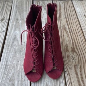 Peep toe lace up booties.